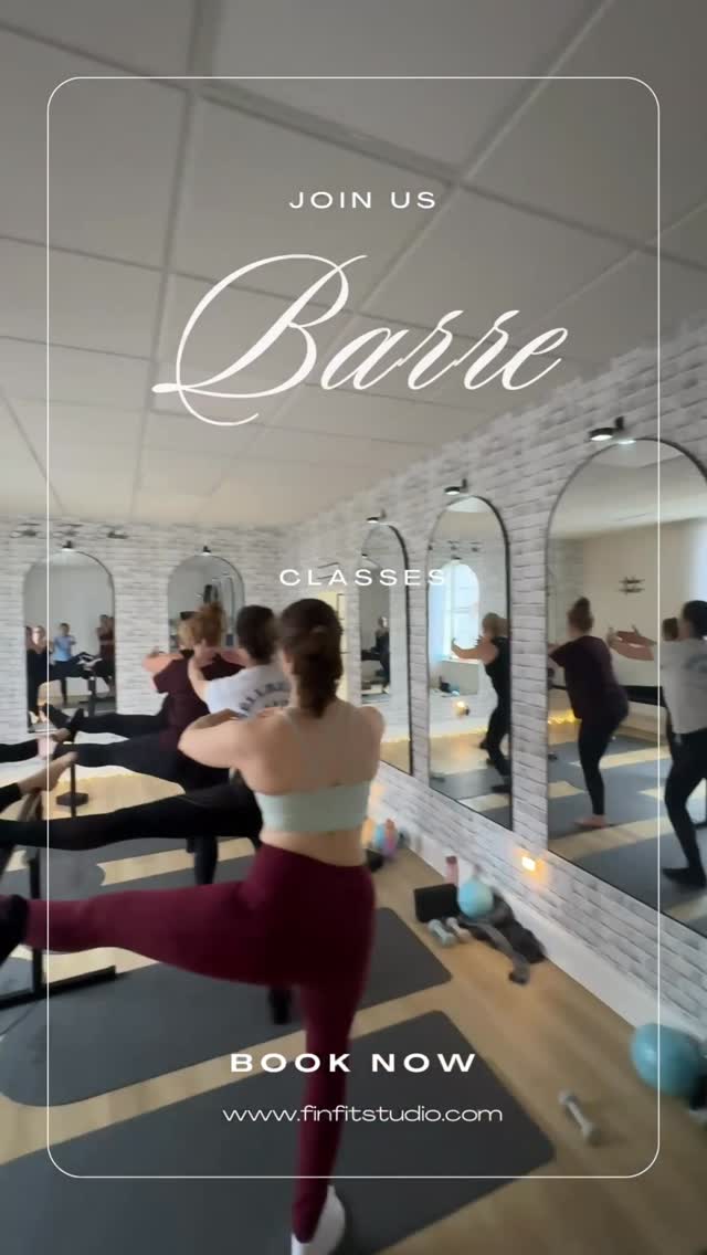 Barre class in standing leg-lifts at the barre